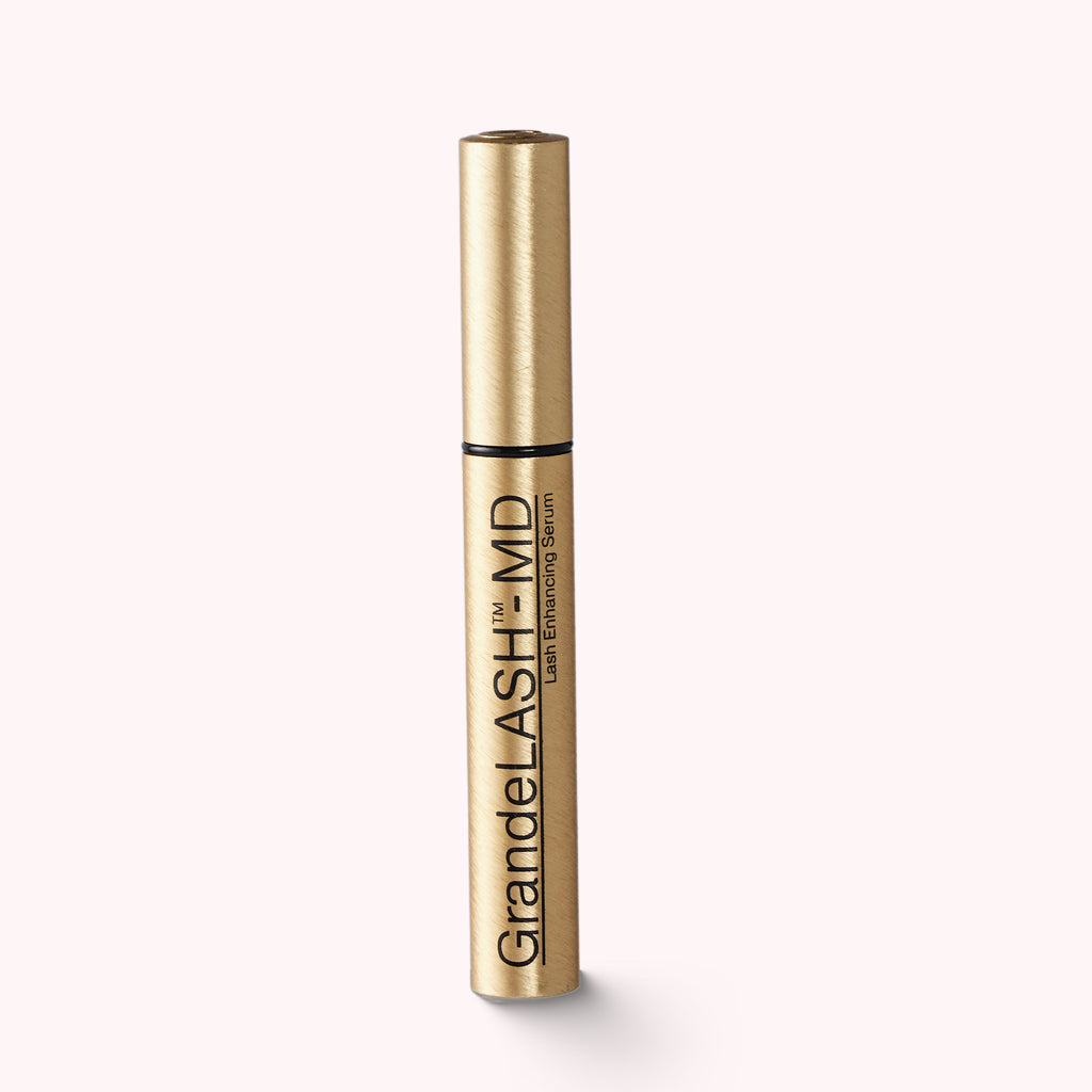 Gold tube with LASH ENHANCING SERUM with blend of vitamins, antioxidants, and amino acids. No parabens. No artificial color or fragrance. 0.1 fl oz / 3 ml