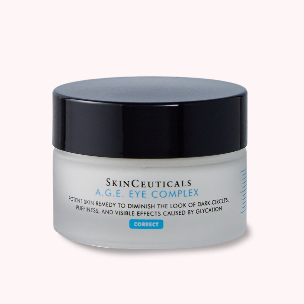 Container with SKINCEUTICALS A.G.E EYE COMPLEX to diminish the look of dark circles, puffiness and visible effects caused by glycation
