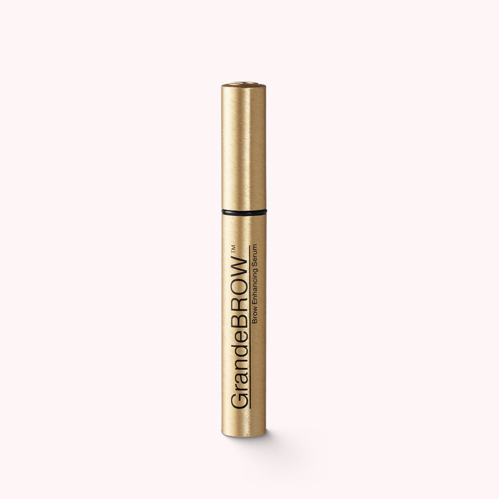 Golden tube with GRANDE COSMETICS BROW ENHANCING SERUM infused with a blend of vitamins, antioxidants, and amino acids.  No parabens. No artificial color or fragrance.  0.1 fl oz / 3 ml